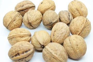 Walnuts located on a white background