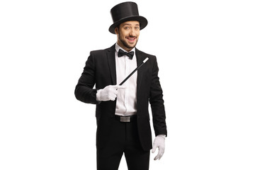 Male magician standing with a magic wand