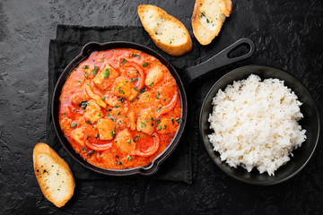 Fish Stew cooked in a delicious  rich and fragrant broth, topped with fresh parsley and served with  rice.