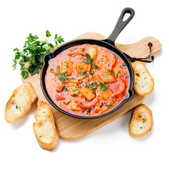 Fish Stew cooked in a delicious  rich and fragrant broth, topped with fresh parsley and served with  rice. isolated on white background