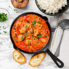 Fish Stew cooked in a delicious  rich and fragrant broth, topped with fresh parsley and served with  rice.