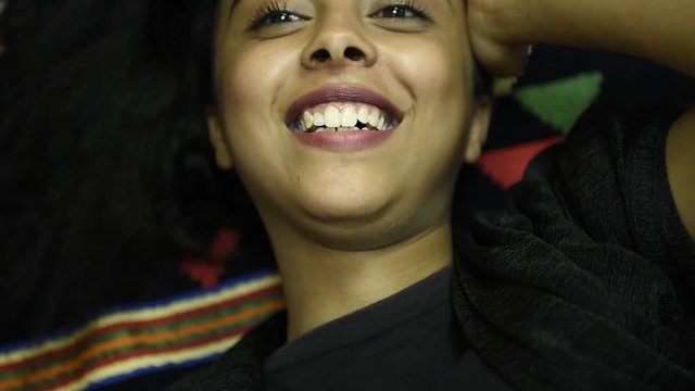 Portrait of a smiling young casual brunette middle eastern girl , Overjoyed girl , Photo of African girl wears black shirt , Emotions and pleasant feelings concept.