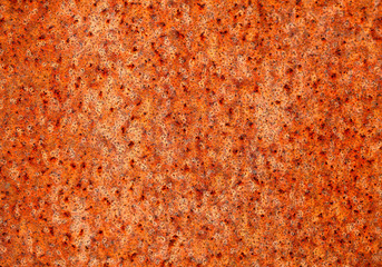 Close up of a modern orange rusty metal plate 