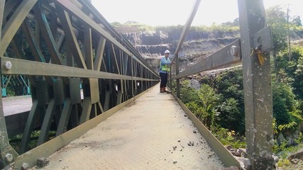 Fototapeta premium a man on bridge in the forest
