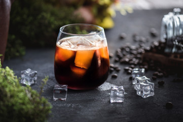 Ice coffee on rustic background