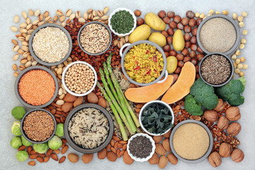 Vegan food for a healthy diet with foods high in protein, vitamins, minerals,omega 3, antioxidants, smart carbs & dietary fibre. Ethical eating concept. Flat lay, top view.