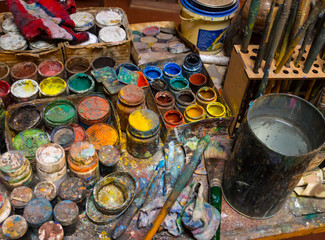 Artistic paintbrushes, paints and palette knifes