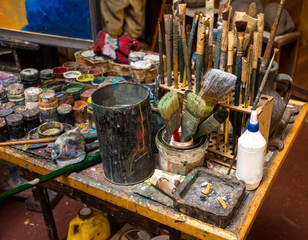 Artistic paintbrushes, paints and palette knifes