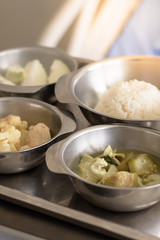 Thai food in a tray for hospital patients.