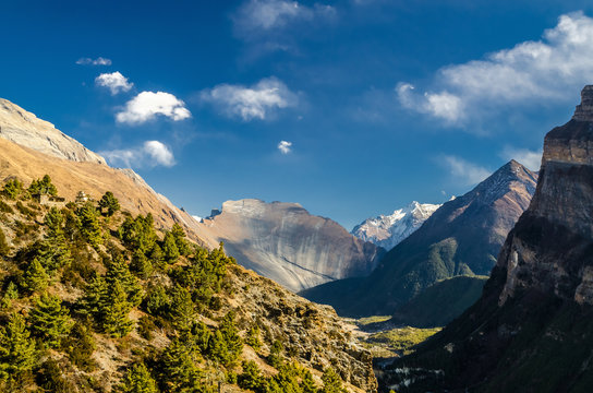 Marshyangdi river valley view with the Swargadwari Danda rock. Annapurna circuit trek, Nepal.