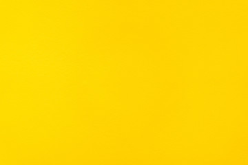 Texture background of concrete wall painted by yellow color. © DG PhotoStock