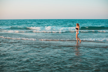 Spring - Summer season. Vacation and travelling time. Woman at sea, pretty nice view 