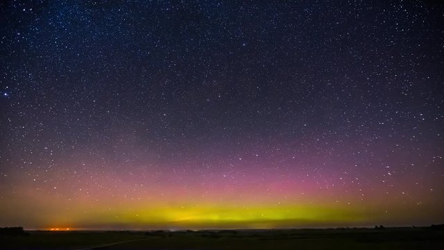 Northern lights timelapse in the night sky