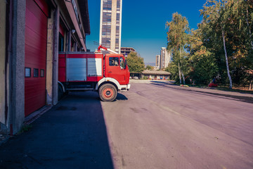 Fire engine leaving the garage of the fire station