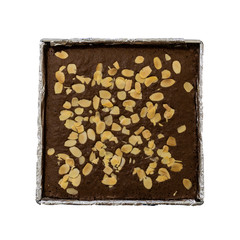 Isolated object on white background. Dark chocolate almond brownie in a tray close up. Healthy eating concept.