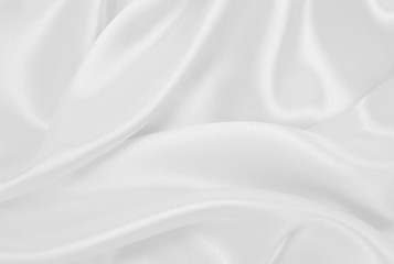 Obraz premium Gładka elegancka biała jedwabna lub satynowa luksusowa tkanina jako tło ślubne. Luksusowy projekt tła