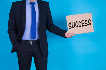 businessman with banner and text, concept of success in business