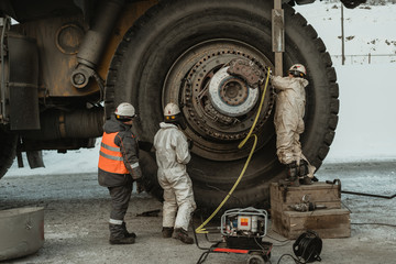 Repair of a mining dump truck at the gold mine site.