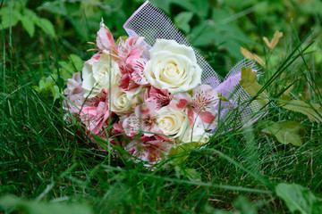 Wedding bouquet on a green background. A close-up.