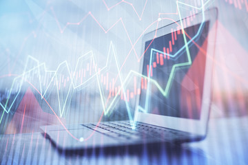Forex Chart hologram on table with computer background. Double exposure. Concept of financial markets.