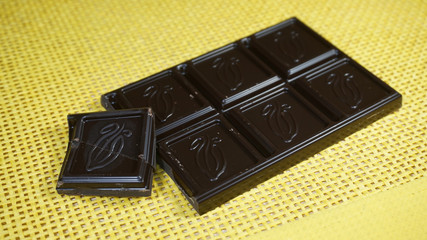 Dark chocolate on a yellow napkin