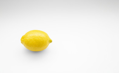 Lemon with shadows on white background