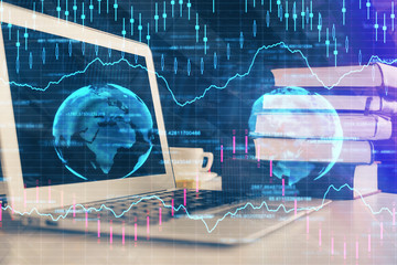 Financial market graph hologram and personal computer on background. Multi exposure. Concept of forex.