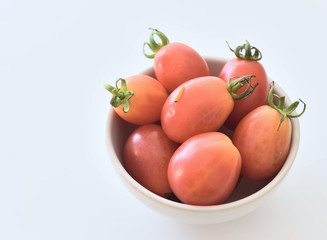 Worm with tomato on white background