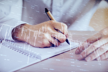 Multi exposure of man planing investment with stock market forex chart.