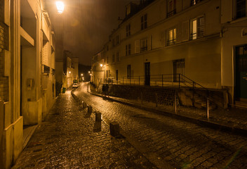 Fototapeta na wymiar PARIS, FRANCE - FEBRUARY 1, 2019: Street in Monmartre district at night