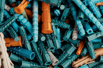 Plastic plugs for screws.Background of the dowels for the screws
