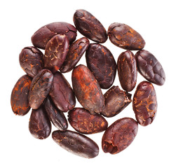 Heap of roasted cacao beans isolated on a white background. Top view.