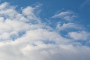 The sky is dark blue with cumulus white and gray clouds. Natural photography without processing.