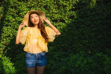 Portrait young asian woman happy smile relax around outdoor nature garden