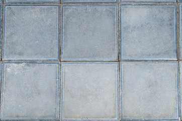 old gray ceramic square tile in the amount of six pieces in an enlarged view