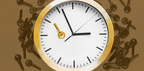Blank keys for cutting on a color background and golden key on the clock