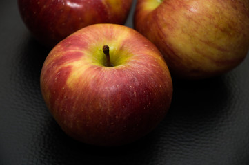 apples on black background