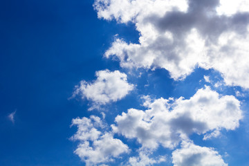 Blue summer sunny sky with white clouds.Background.