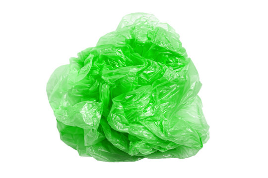 Green Plastic Bag On A White Background, Isolate. Used Plastic Bag For Recycling. Recycling Of Plastic Waste Into Pellets As A Business.