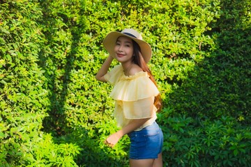 Portrait young asian woman happy smile relax around outdoor nature garden