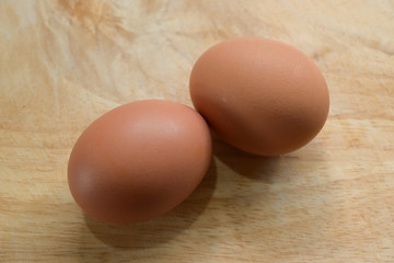 hen egg put on wood cutting board in kitchen prepare cooking
