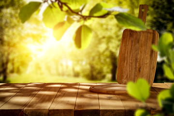 Spring sunny day and desk of free space cover of shadows.Copy space for your product and spring sun...