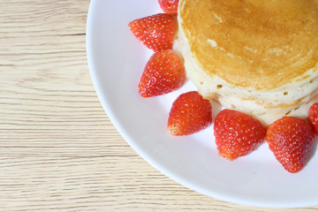 pancake and strawberry fruit sweet dessert food put on breakfast table