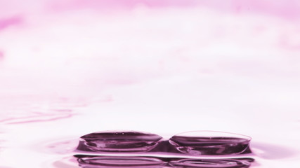 Tools for vision correction. Glasses and lenses with diopters on the background of splashes and...