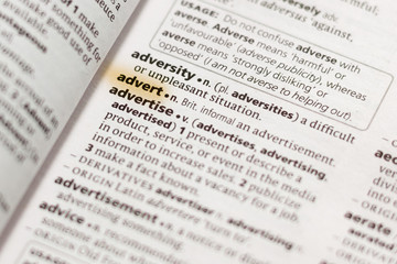 Naklejka premium The word or phrase Advert in a dictionary.