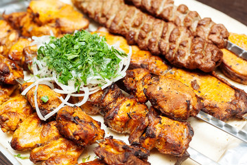 Spiced meat with herbs and onions, fried in tandoor. Shish kebab. Barbecue.