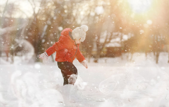 Children Play Outside In The Winter. Snow Games On Street.