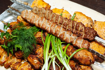 Spiced meat with herbs and onions, fried in tandoor. Shish kebab. Barbecue.