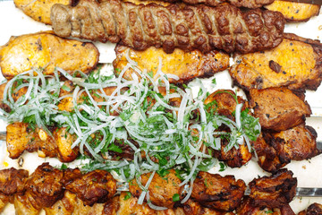 Spiced meat with herbs and onions, fried in tandoor. Shish kebab. Barbecue.