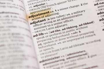 Ivanovsk, Russia - November 19, 2018: The word or phrase Adjustment in a dictionary.